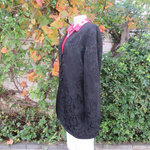 Stunning black boutique made brocade fully lined long sleeve collar less jacket. Size 42/18.New cond