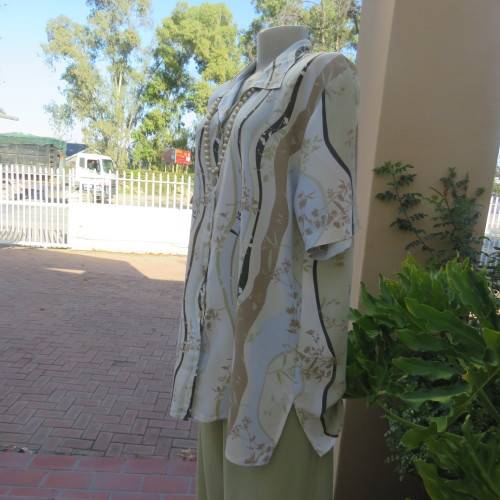 Pretty short sleeve button down/open collar top in vertical pattern lines.Soft colours.Size 48/24