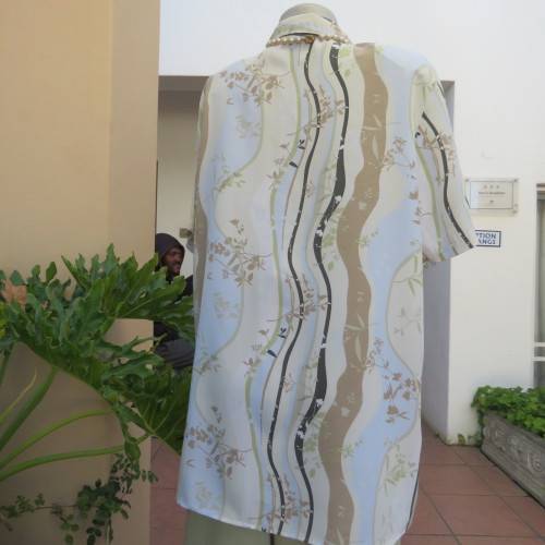 Pretty short sleeve button down/open collar top in vertical pattern lines.Soft colours.Size 48/24