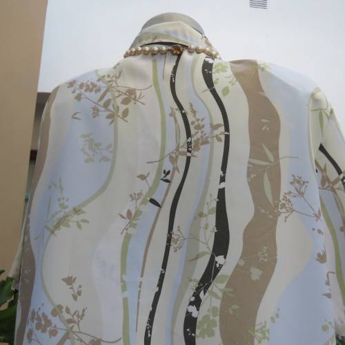 Pretty short sleeve button down/open collar top in vertical pattern lines.Soft colours.Size 48/24