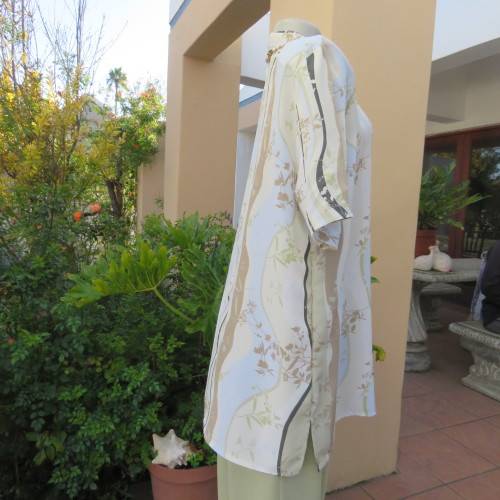 Pretty short sleeve button down/open collar top in vertical pattern lines.Soft colours.Size 48/24