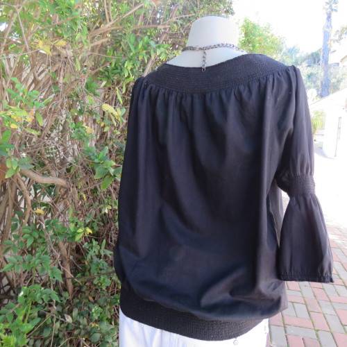 Pretty peasant style black 100% cotton top. Elasticated neckline and hemline. Size 40/16.WOOLWORTHS