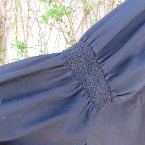 Pretty peasant style black 100% cotton top. Elasticated neckline and hemline. Size 40/16.WOOLWORTHS