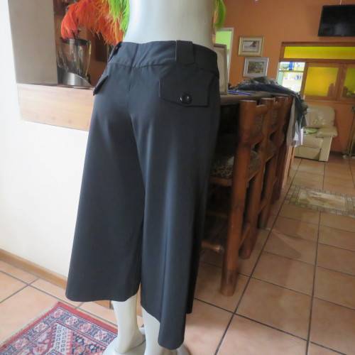 As new black stretch polyester culotte pants size 36/12 by CONNECTION. Dummy pockets. Belt loops
