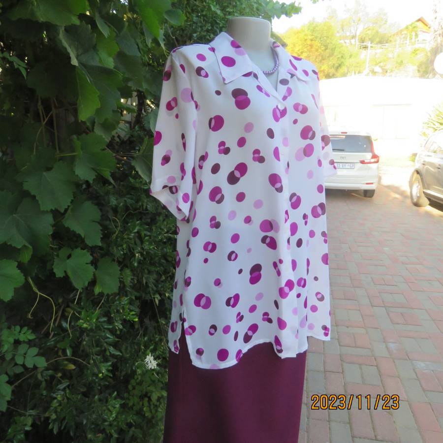 Notice me white sheer polyester short sleeve top with purple dots. Size 42/18.Button down. As new.