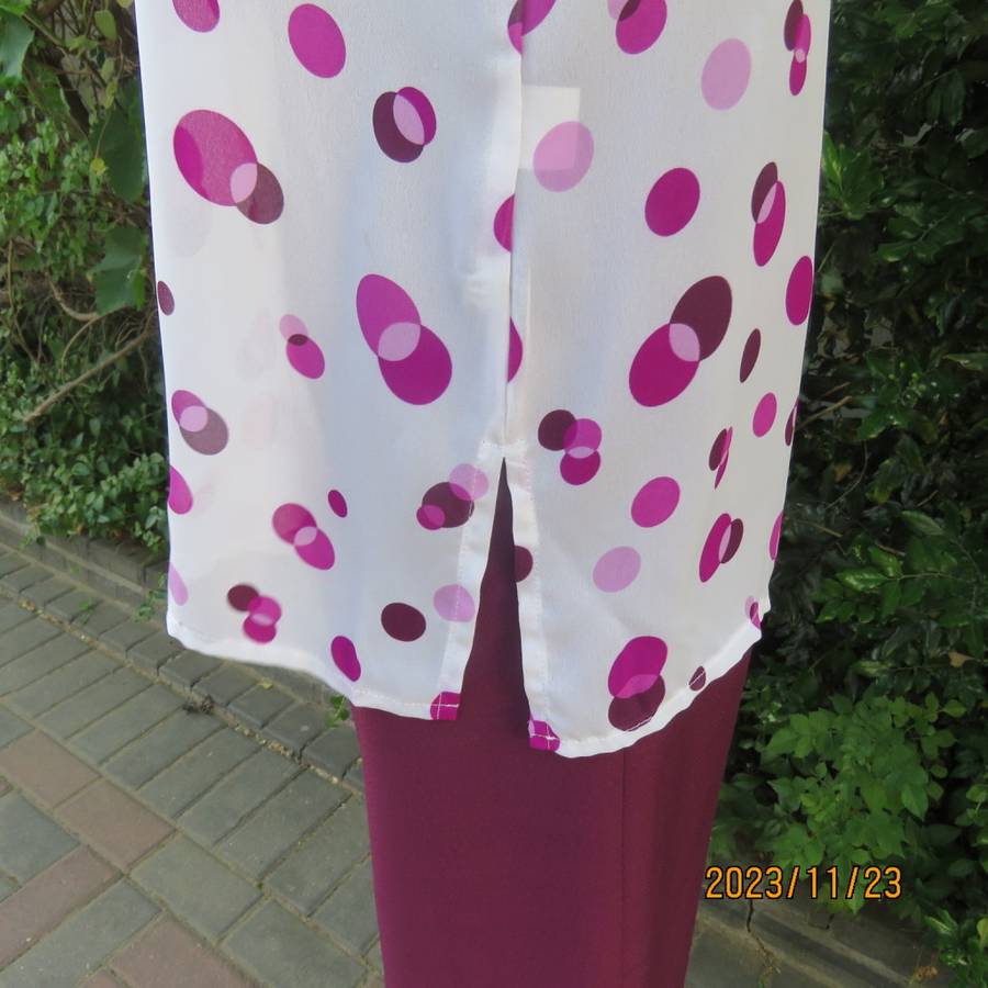 Notice me white sheer polyester short sleeve top with purple dots. Size 42/18.Button down. As new.