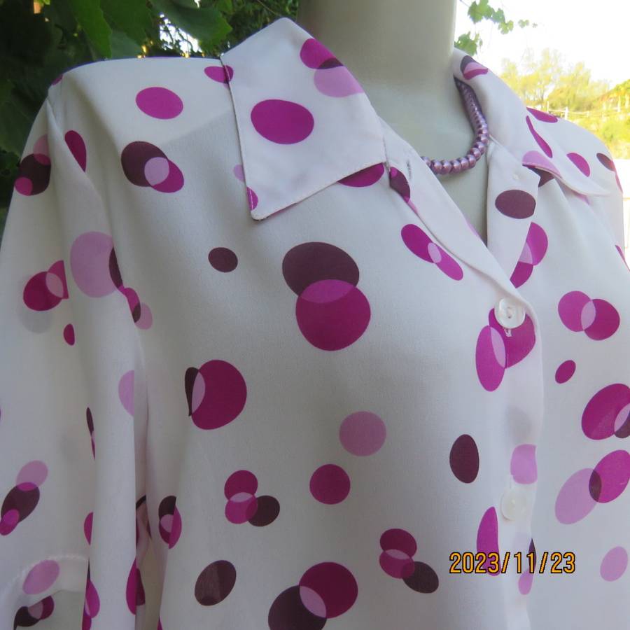 Notice me white sheer polyester short sleeve top with purple dots. Size 42/18.Button down. As new.
