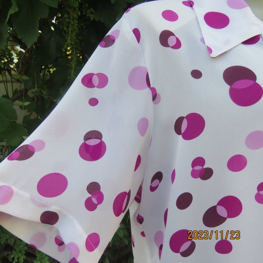 Notice me white sheer polyester short sleeve top with purple dots. Size 42/18.Button down. As new.