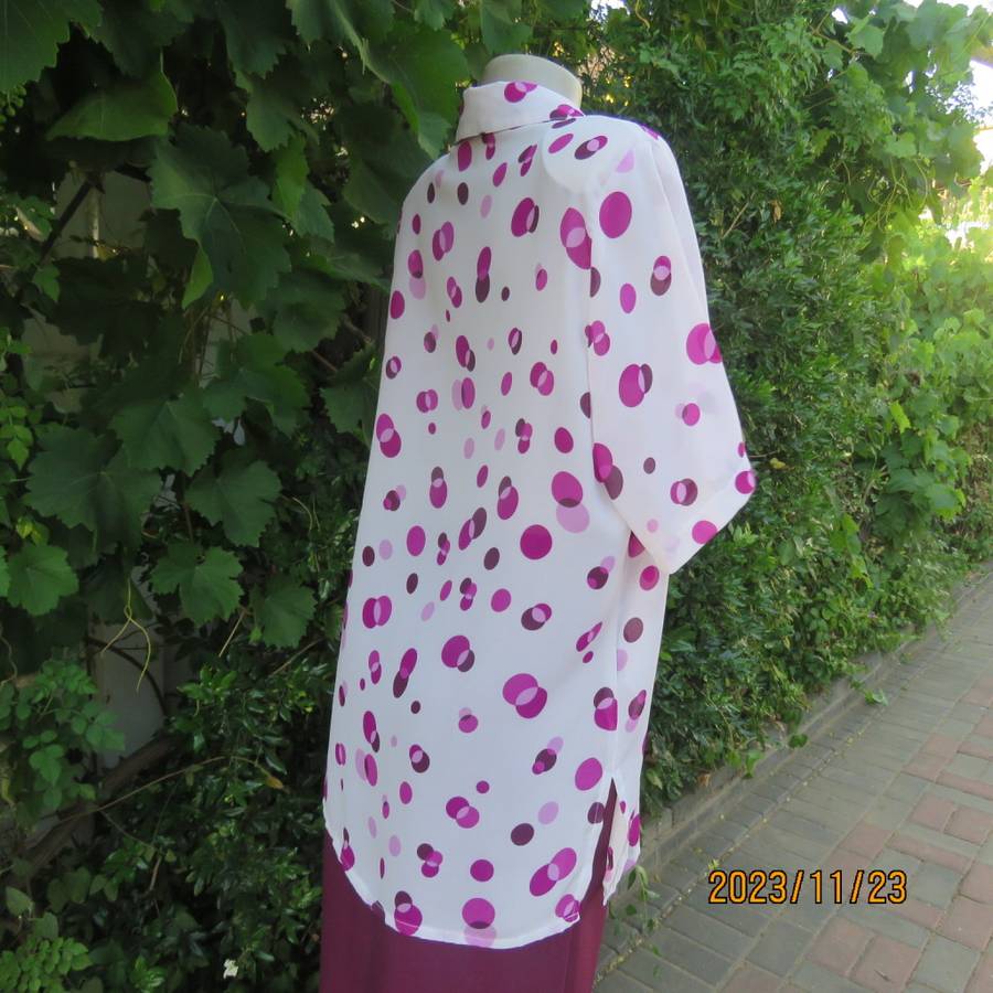 Notice me white sheer polyester short sleeve top with purple dots. Size 42/18.Button down. As new.
