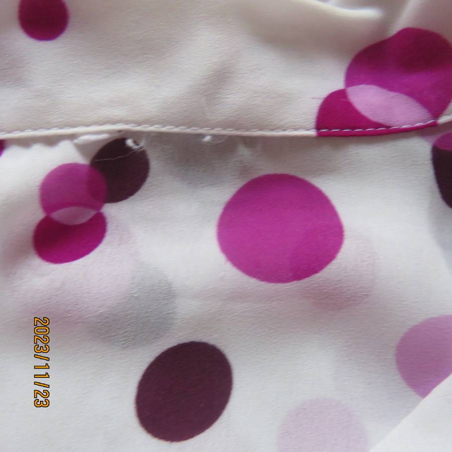 Notice me white sheer polyester short sleeve top with purple dots. Size 42/18.Button down. As new.