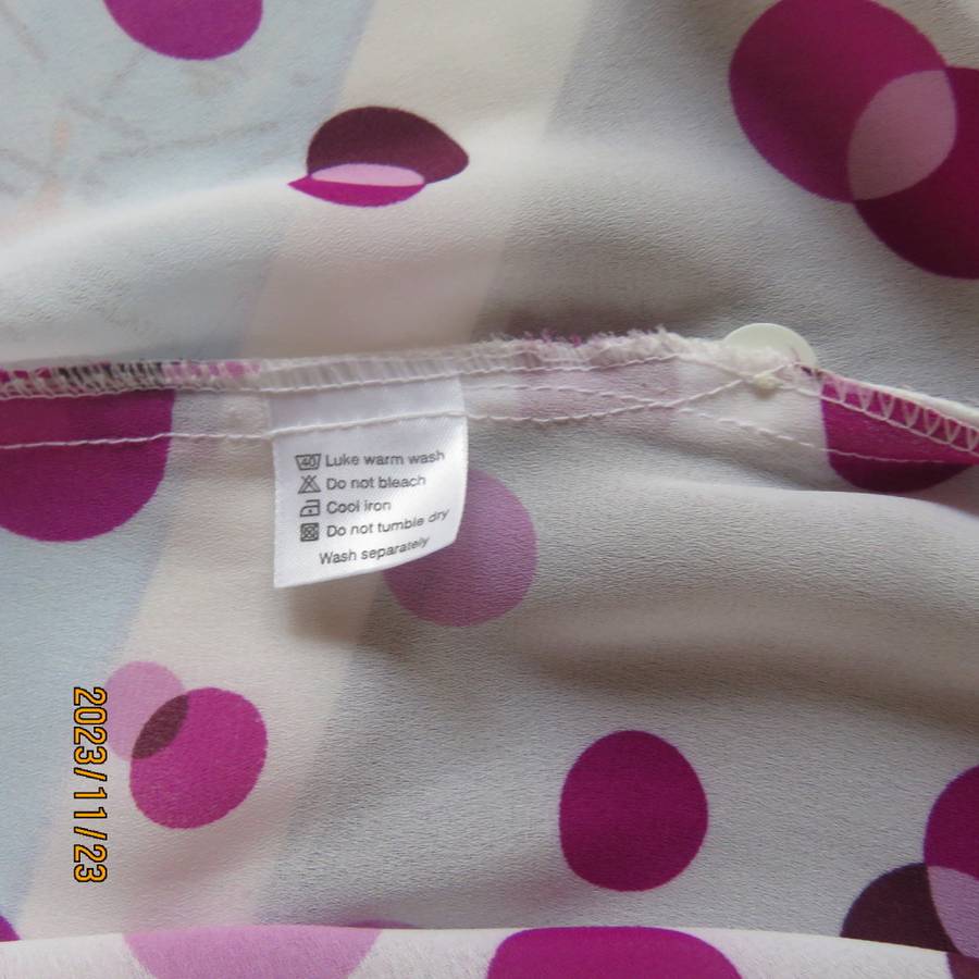 Notice me white sheer polyester short sleeve top with purple dots. Size 42/18.Button down. As new.