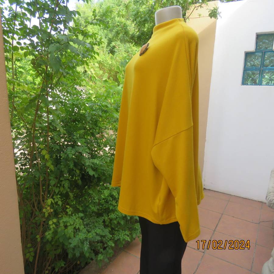 What not to like about this amber yellow warm polyknit top! Dolman sleeves. High cut neckline. 48/50