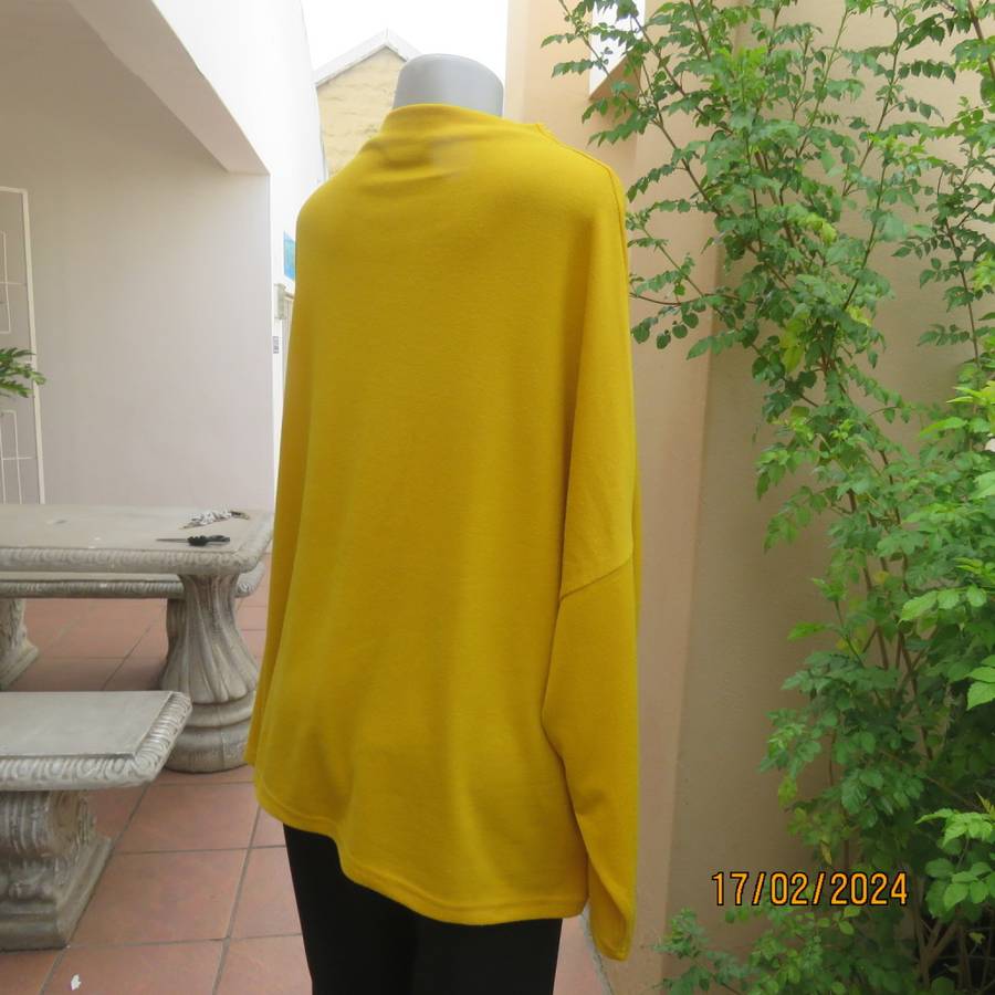 What not to like about this amber yellow warm polyknit top! Dolman sleeves. High cut neckline. 48/50