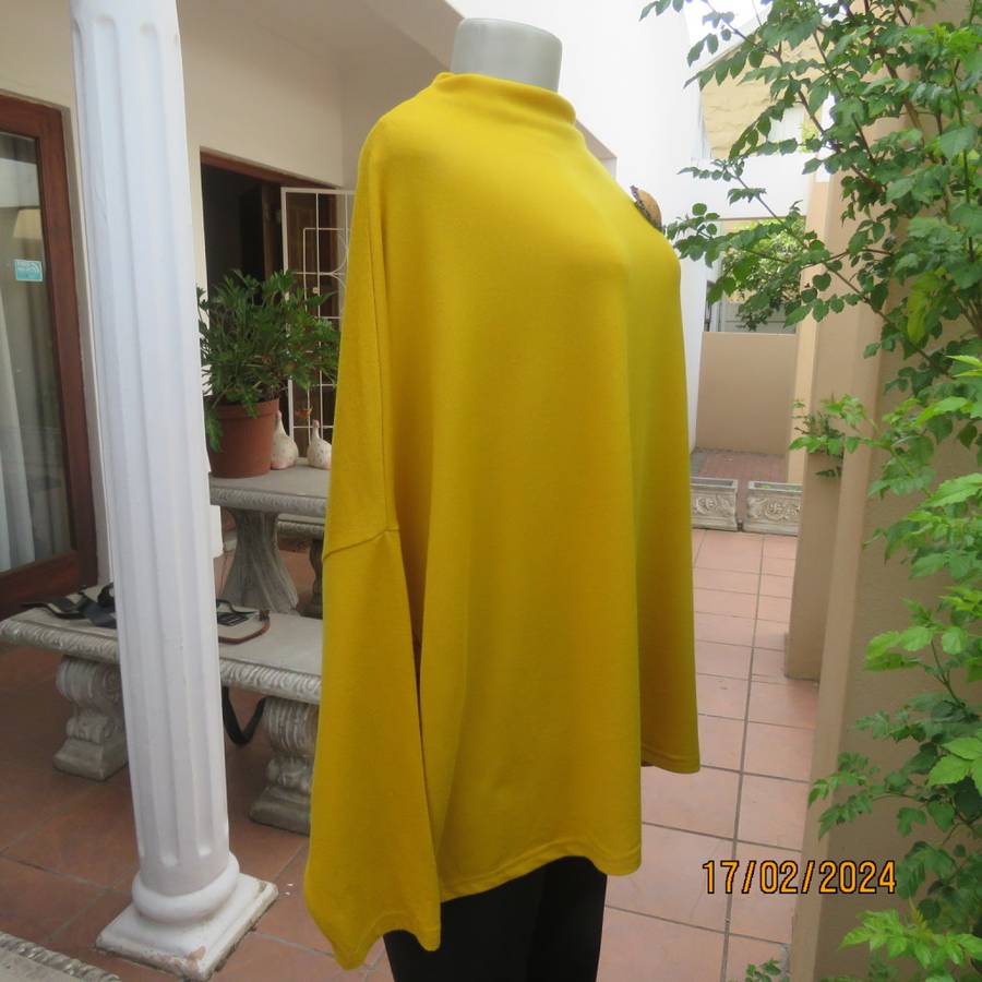 What not to like about this amber yellow warm polyknit top! Dolman sleeves. High cut neckline. 48/50