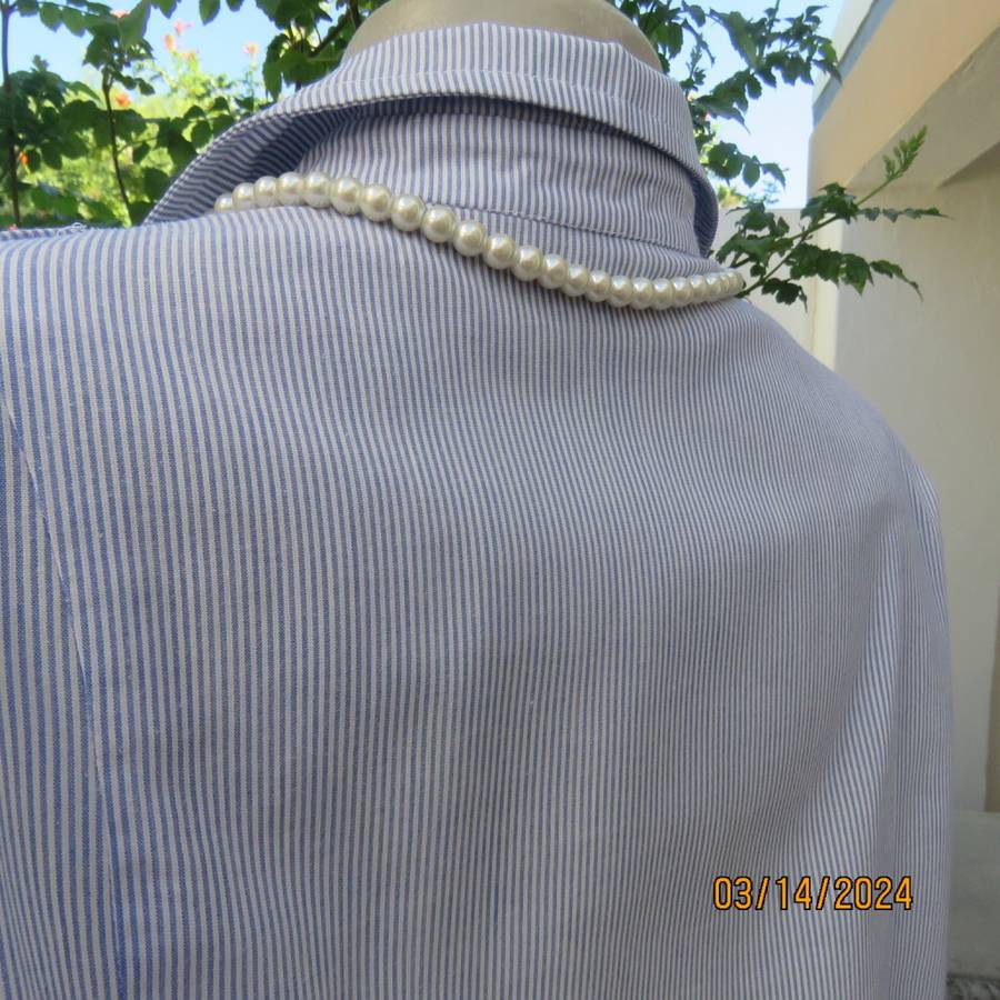 Casual long sleeve cotton blue/white striped button down shirt with collar. Size 40. No label.As new