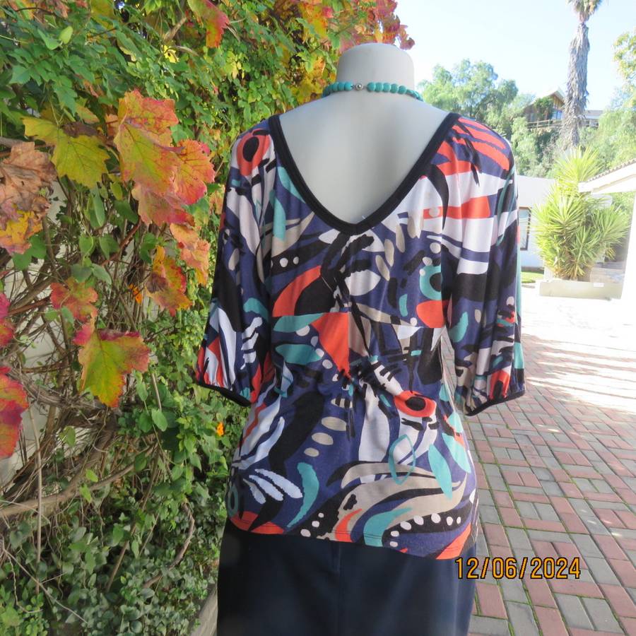 Geometric printed soft viscose stretch empire waist V neck cross over colourful top. WOOLWORTHS 38
