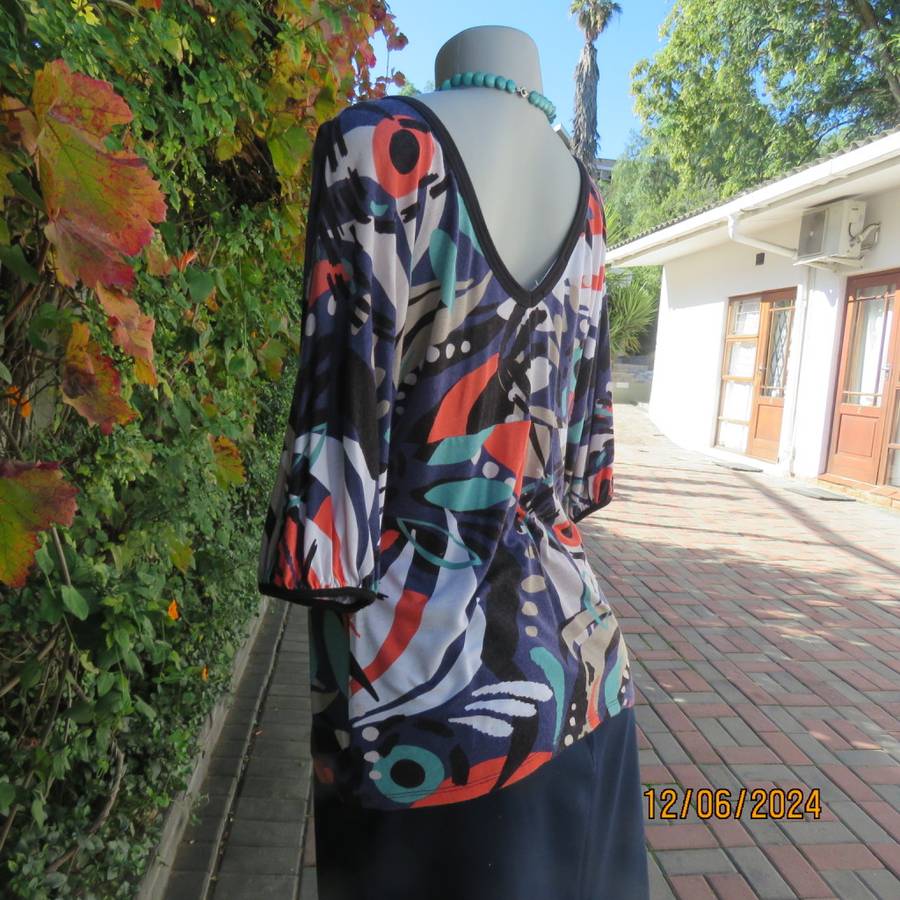 Geometric printed soft viscose stretch empire waist V neck cross over colourful top. WOOLWORTHS 38