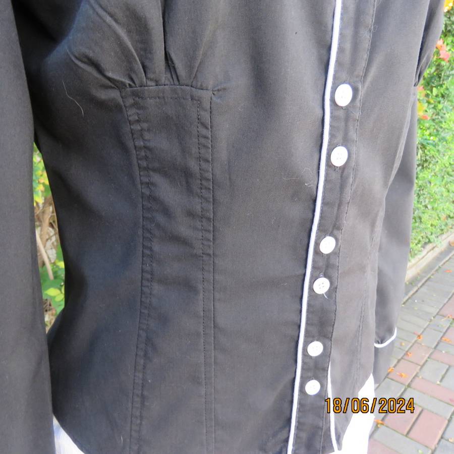 Charming long sleeves black tailored top. V button down front/collar. White edging/buttons.Size 36.