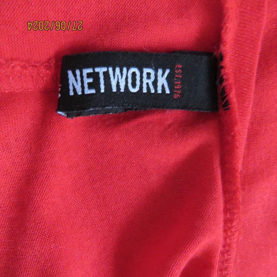 Fired up in red! Naked shoulder slip over viscose stretch top. Short cut-on sleeves.Size 42.As new.