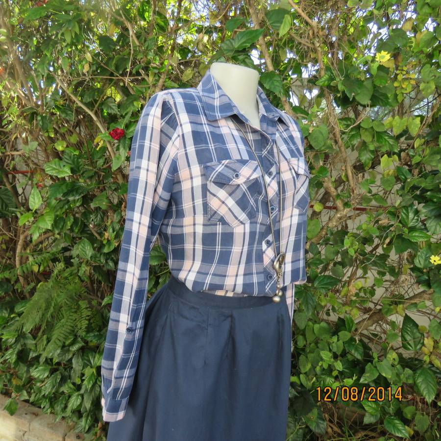 Casual long sleeve check button down top in blues.Peach touches. Two pockets.By IDENTITY.Size 36.