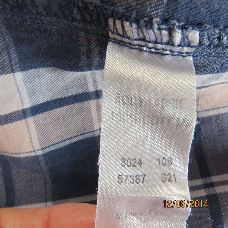 Casual long sleeve check button down top in blues.Peach touches. Two pockets.By IDENTITY.Size 36.