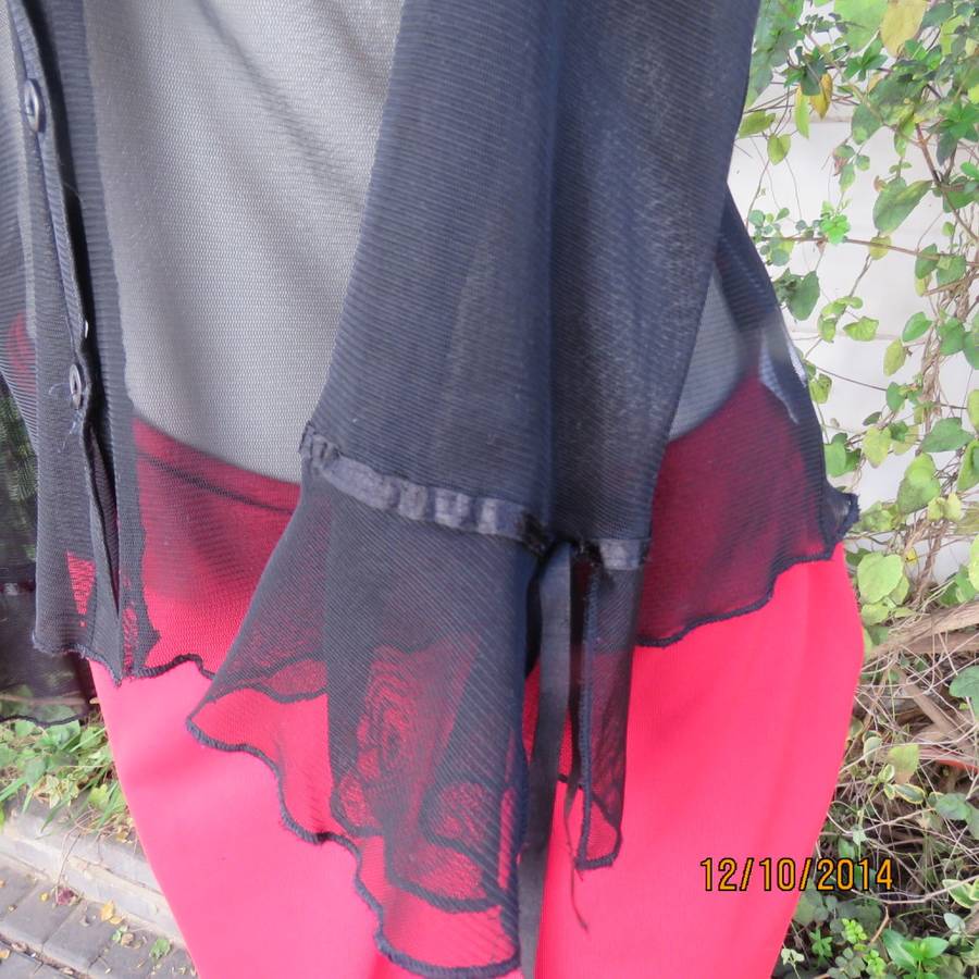 Chic black sheer polyester button down top/open collar. Pretty flare cuffs on sleeves.Size 36.As new