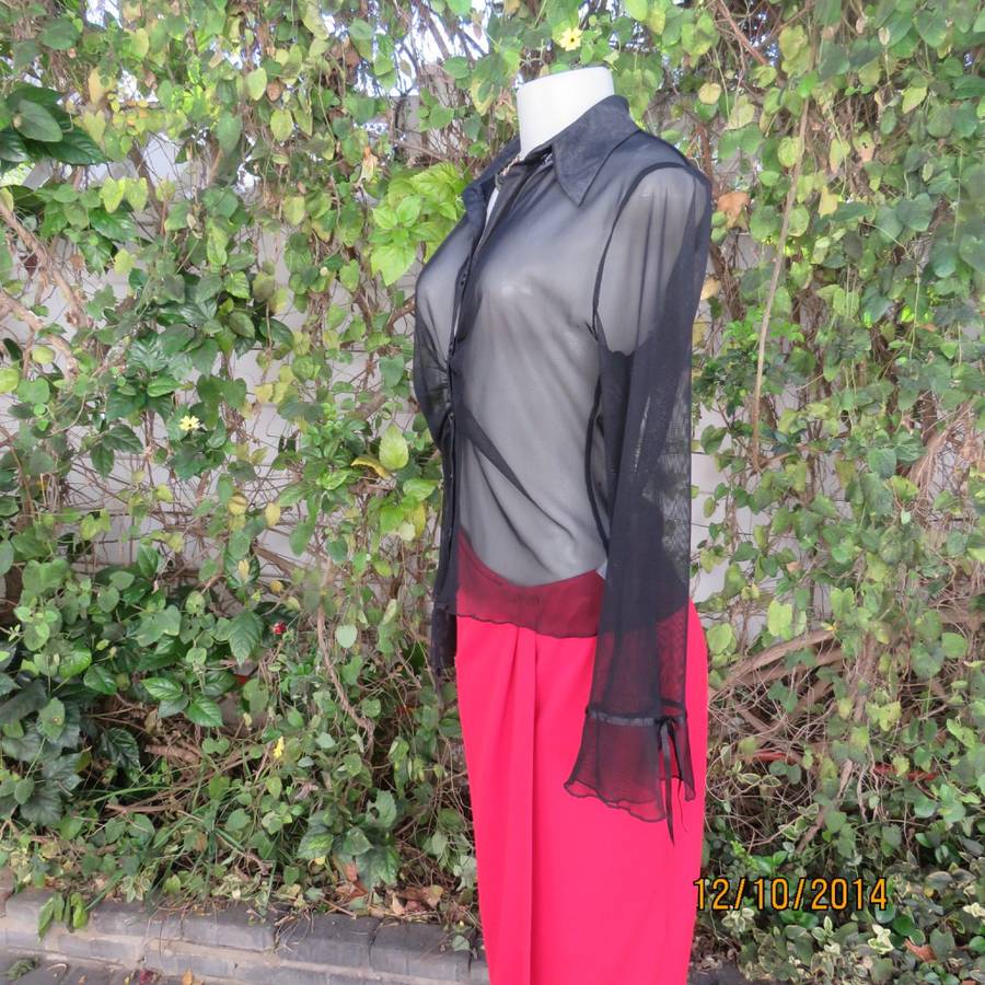 Chic black sheer polyester button down top/open collar. Pretty flare cuffs on sleeves.Size 36.As new