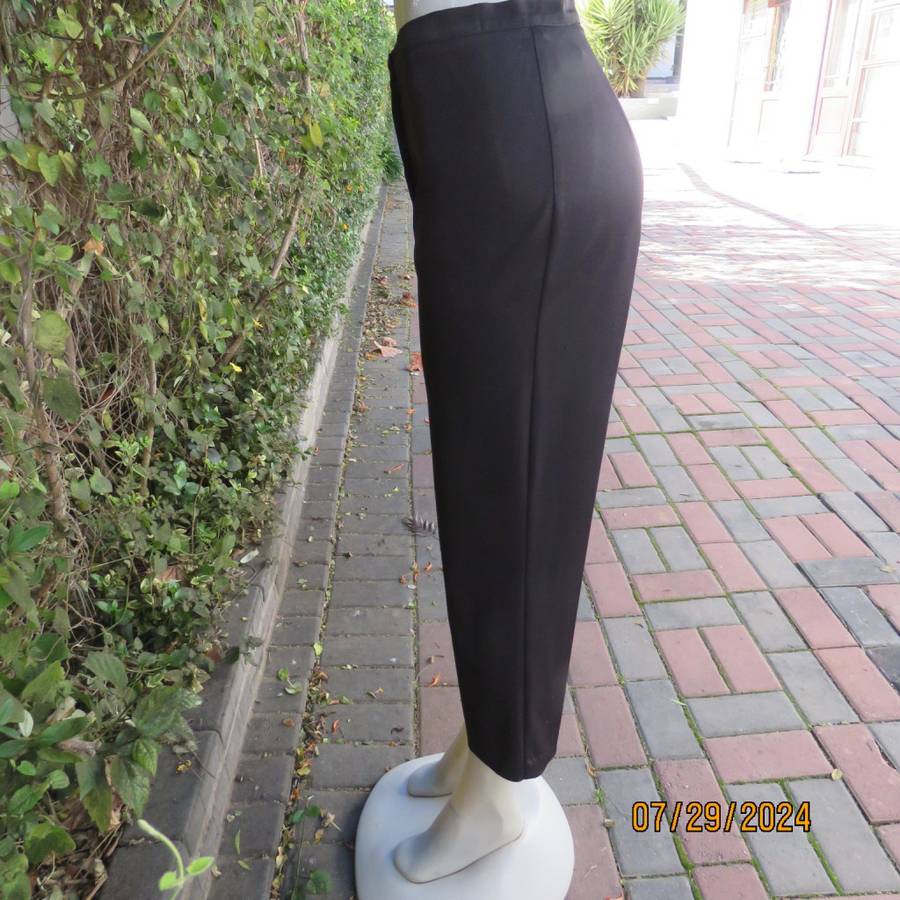 Black silky,shiny stretch polyester ankle length pants by MERIEN HALL size 35. Very good condition