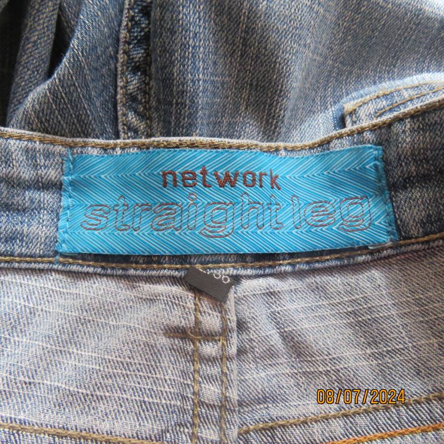 Blue denim straight legged jeans with tapering. Size 36. Pockets back-front.