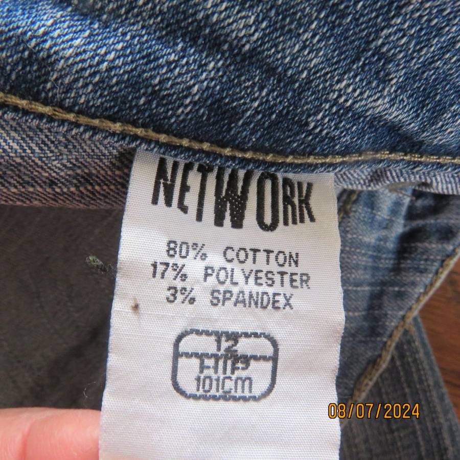 Blue denim straight legged jeans with tapering. Size 36. Pockets back-front.
