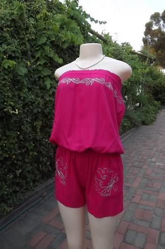 Dark pink Jumpsuit with embroidery on strapless top and short pockets from Audacity.Size 35/11.Used