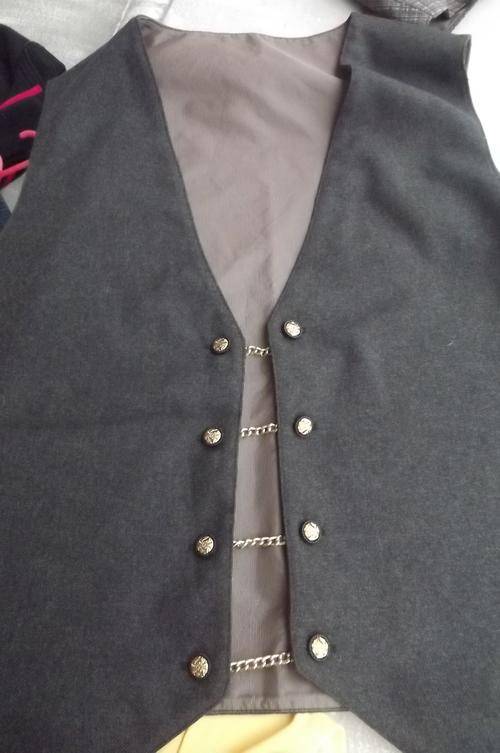 Brown Men's waistcoat.Fully lined.Size Large.2Sets of buttons and buttonholes with short chains.
