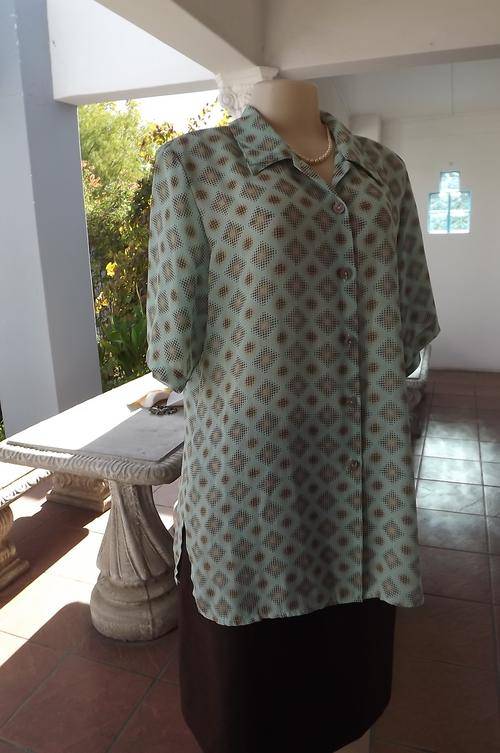 Pastel turquoise blouse with diamond shaped gold pattern.Size 40/16 by Judy's Pride.Slitted sides