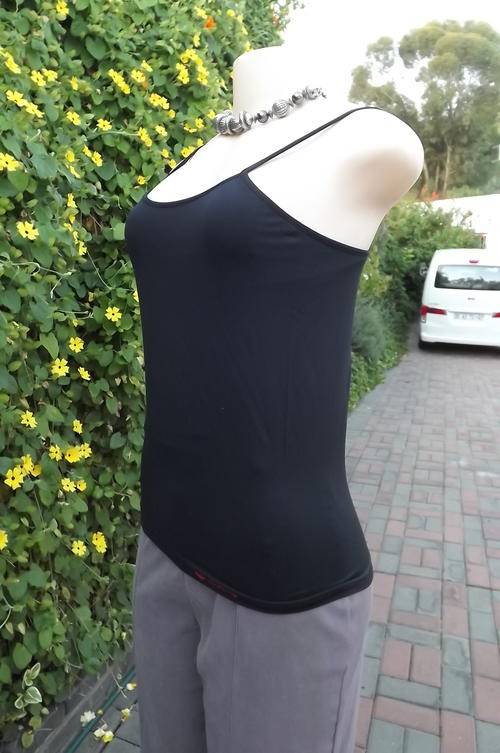Black nylon stretch strappy top with build in bra by Skinny size Large.As new condition