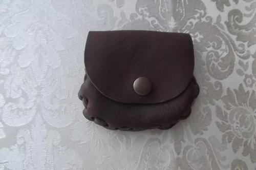 Genuine leather small handmade purse closing with press button.Brown.Nice and soft for your change.