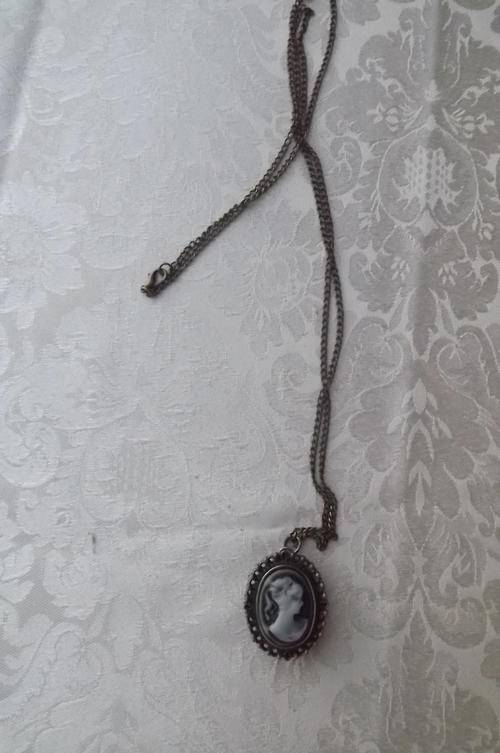 Brass quartz watch working 100% with imitation cameo cover and 80cm chain.New condition