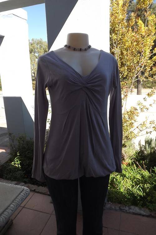 Lavender colour bubble top by Poetry in size 34/10.Made in Mauritius.Gathered V front.Long sleeves.