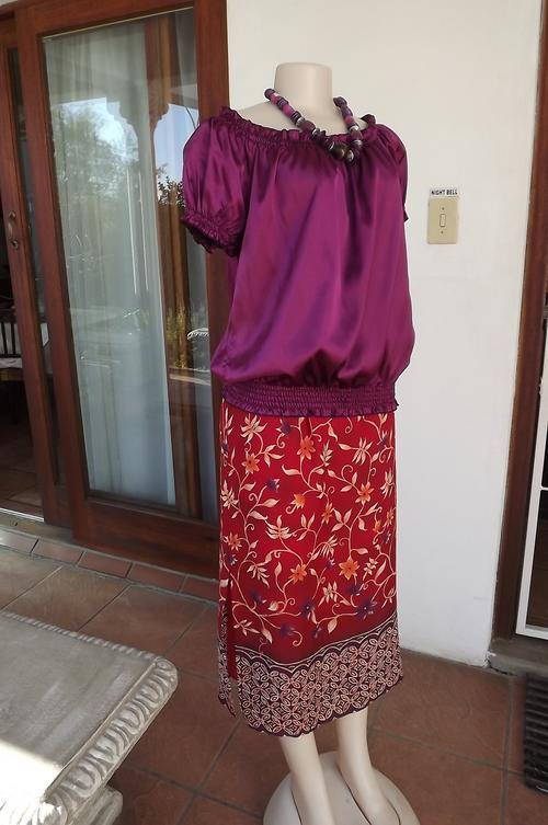 Dark purple silky polyester top.Elasticated neckline,sleeves and waistband.Size 40/16.New condition