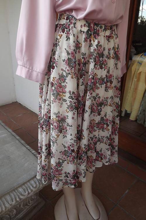 Stunning full flair skirt in 2 layers.Sheer beige polyester with floral pattern.Truworths size 38/14
