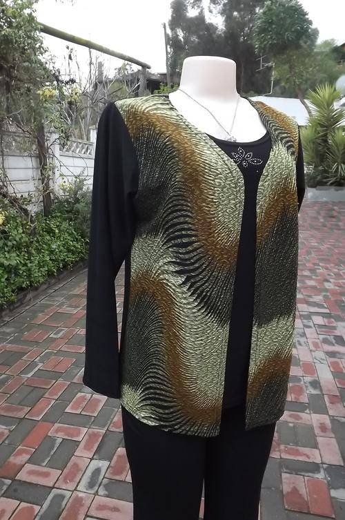 Amazing black stretch polyester long sleeve top with overlay waistcoat size 38/14.Rounded neckline.