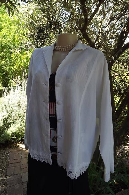 White button down jacket/top with dolman sleeves.Size 40/16.Made by previous owner.Good condition