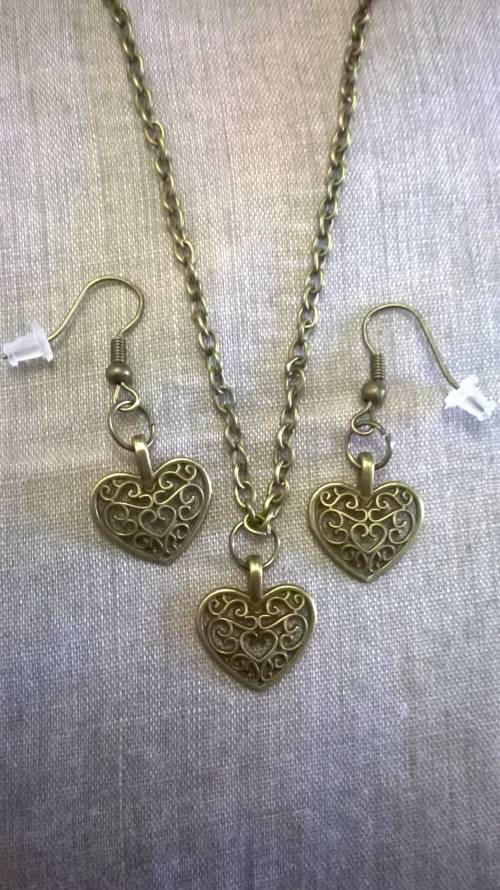 Antique bronze Four piece set.. Necklace, pendant and earrings