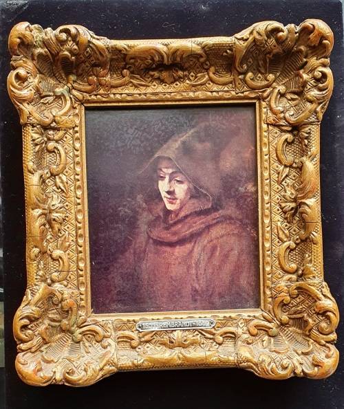 ANTIQUE PRINT OF REMBRANDT IN HEAVY SOLID ORNATE WOOD FRAME.