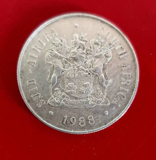 SILVER 1988 DIAS ONE RAND COIN IN SA MUNT BOX. EXCEPTIONAL CONDITION.