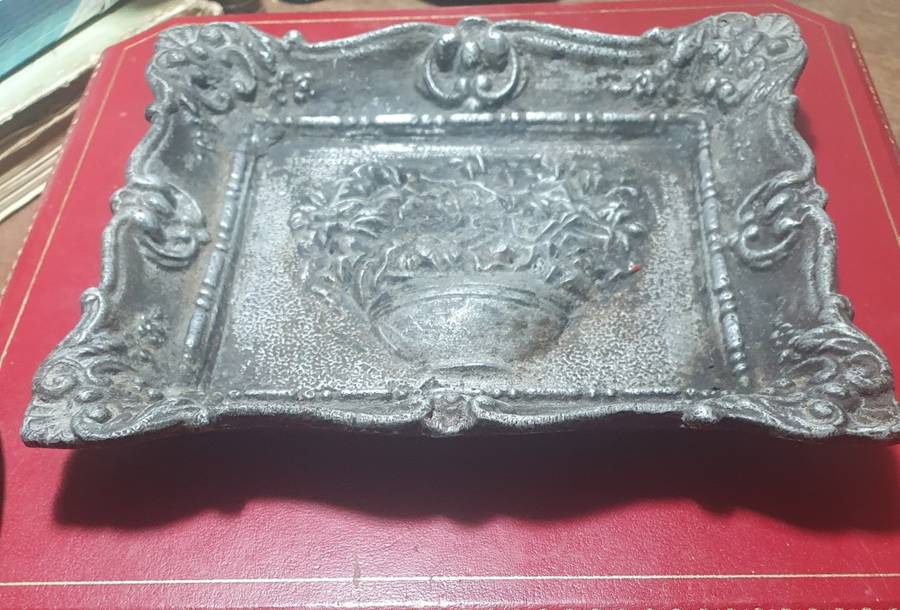 Antique cast iron framed flowers wall plate.