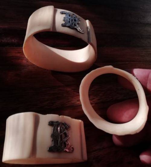 FROM THE VICTORIAN ERA | COLLECTIBLE SET OF 3 IVORY SERVIETTE RINGS EMBELLISHED WITH SILVER LETTERS