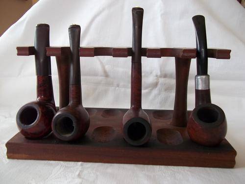 Lot of 4 quality pipes and a 12 slot pipe stand - 1 bid for the lot