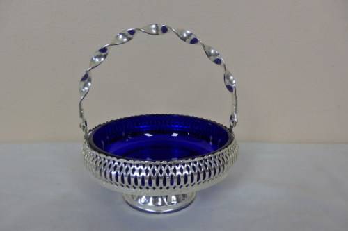 A GORGEOUS ENGLISH MADE SILVER PLATED FOOTED CONDIMENT STAND WITH A "COBALT" BLUE GLASS BOWLS
