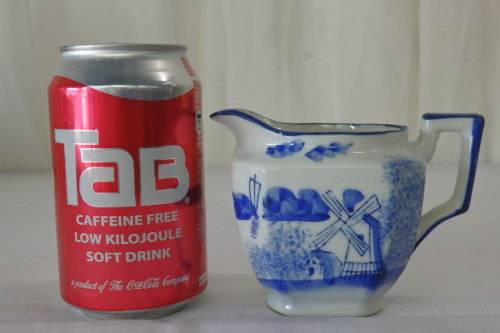 AN AWESOME JAPANESE MADE HAND PAINTED BLUE AND WHITE PORCELAIN MILK JUG