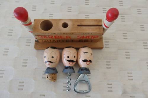 A FABULOUS VINTAGE "BARBER SHOP QUARTET" BAR ACCESSORY SET INCLUDING BOTTLE OPENER ETC